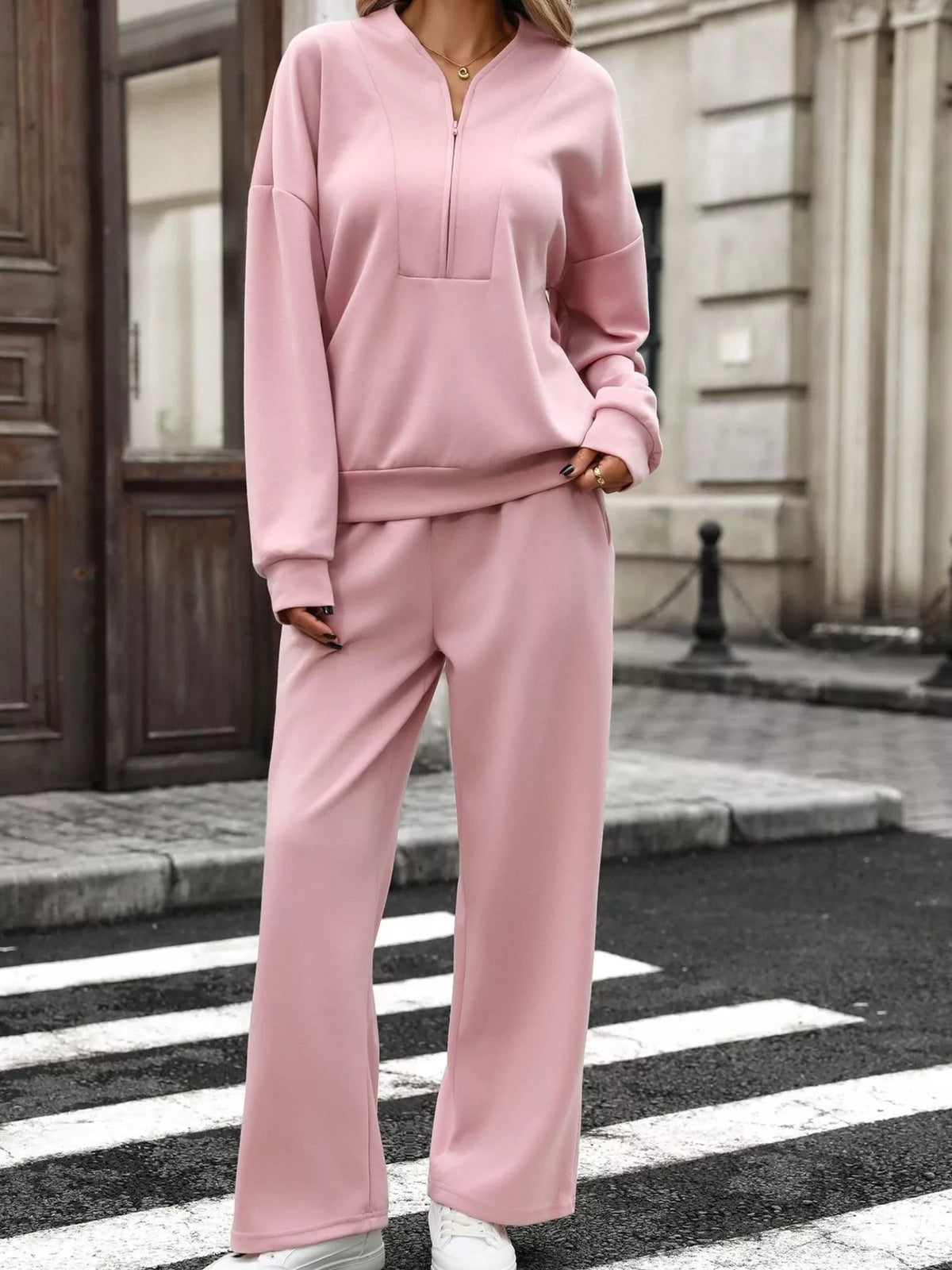Women’s half zip sweatshirt and wide-leg pants set by Trendsi, featuring a casual, comfortable lounge outfit in neutral tones.