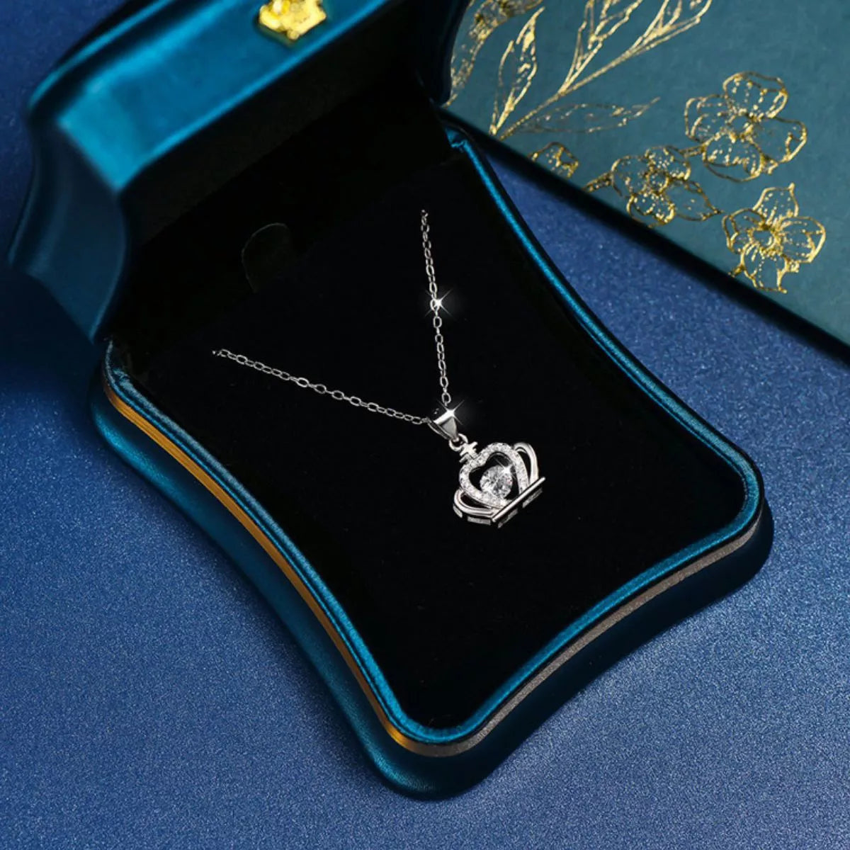 Sterling silver zircon crown pendant necklace with intricate design, perfect for elegant jewelry collection.