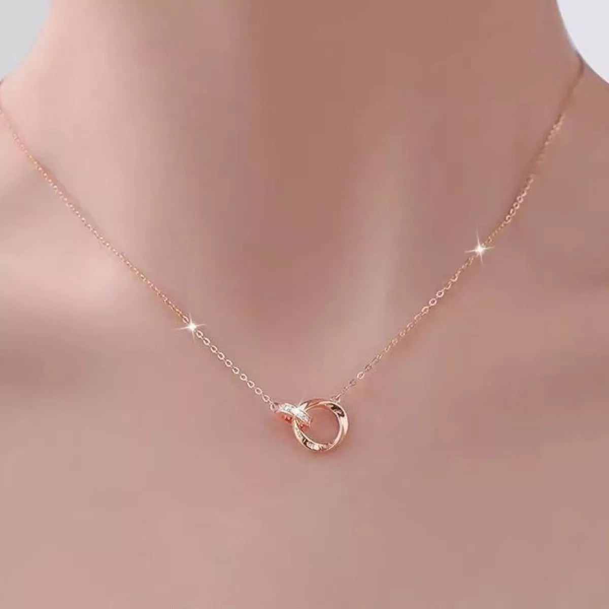 Elegant 18K rose gold-plated sterling silver necklace with a delicate chain, showcasing a stylish jewelry piece from Plush Fashion Hub.