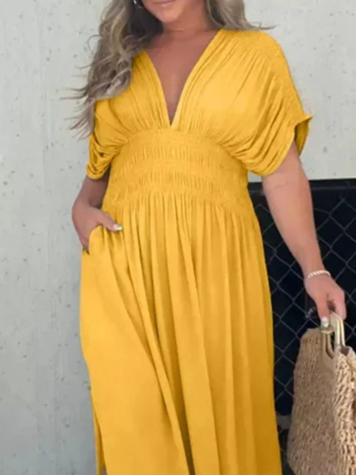 Plus size full slit V-neck smocked waist maxi dress by Plush Fashion Hub, featuring a flowing silhouette and elegant design.