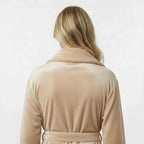 Back view of beige Lotus Linen women's ultra-soft plush bathrobe, displaying the cozy fabric and relaxed fit.