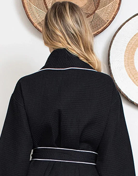 Women's black plush bathrobe with piping from Lotus Linen, featuring a waffle texture and back view.
