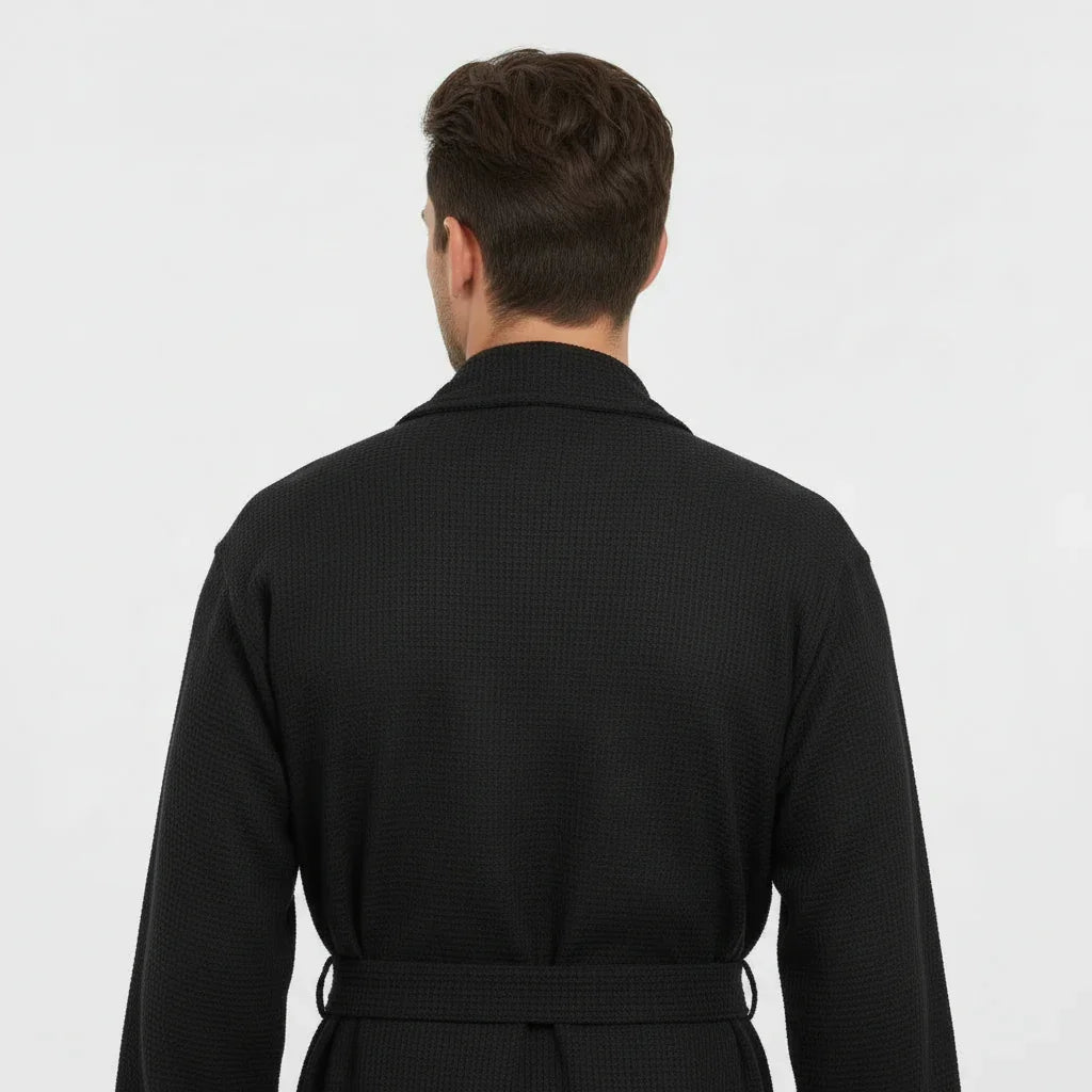 Black Lotus Linen men's waffle spa bathrobe viewed from the back, lightweight and absorbent for comfortable lounging.
