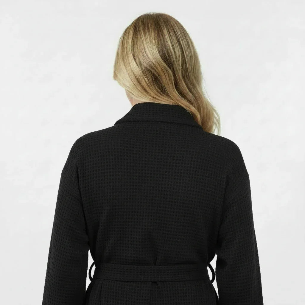 Black lightweight Lotus Linen women's waffle robe with short back view, showcasing quick-dry spa comfort fabric.