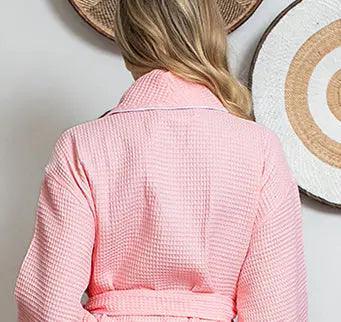 Back view of Lotus Linen women's blush waffle piping bathrobe with lightweight spa-style design and piping details.