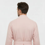 Back view of Lotus Linen men's premium waffle piping robe in blush, showcasing soft fabric and piping details.