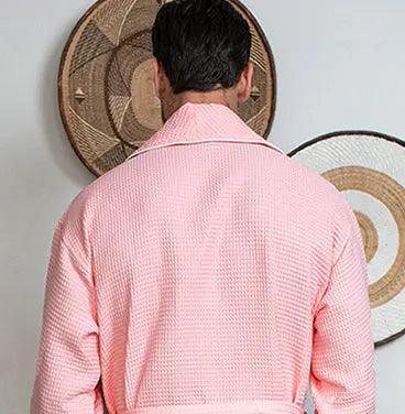 Back view of Lotus Linen men's premium waffle piping robe in blush, showcasing small size, piping details, and soft textured fabric.