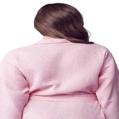 Back view of a small blush Lotus Linen knee-length waffle robe for women, showing textured fabric and relaxed fit.