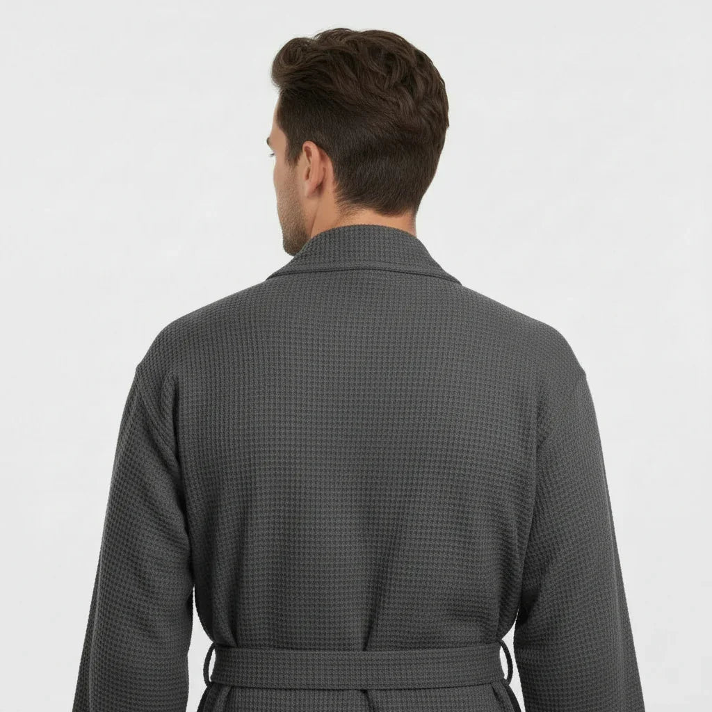 Back view of Lotus Linen men's waffle spa bathrobe in charcoal, lightweight, absorbent, and comfortable for relaxing at home.