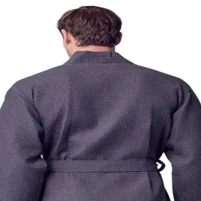 Back view of Lotus Linen men's waffle spa bathrobe in small charcoal, showcasing lightweight and absorbent fabric.