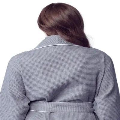 Back view of lightweight grey women’s waffle piping bathrobe by Lotus Linen, spa-style comfort with small piping details.