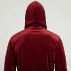 Back view of Lotus Linen men's hooded robe in burgundy-black plush fabric, showcasing the small hood and soft, comfortable material.