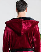 Back view of Lotus Linen men's hooded robe featuring plush burgundy and black fabric, showcasing its cozy hood and comfortable fit.