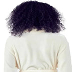 Back view of Lotus Linen women's ultra-soft plush bathrobe showing small natural-colored design and cozy fabric.