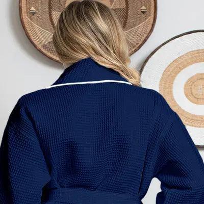Navy women's plush bathrobe with piping from Lotus Linen, showing the back view with waffle fabric detail and small size.
