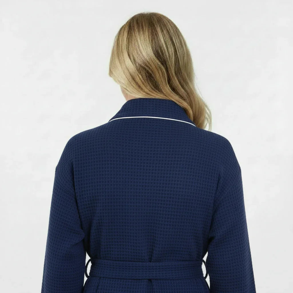 Navy women's waffle piping bathrobe from Lotus Linen, back view showing lightweight spa-style comfort and small size.