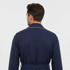Small navy men's waffle piping robe by Lotus Linen, showing back view with contrasting piping details and soft textured fabric.
