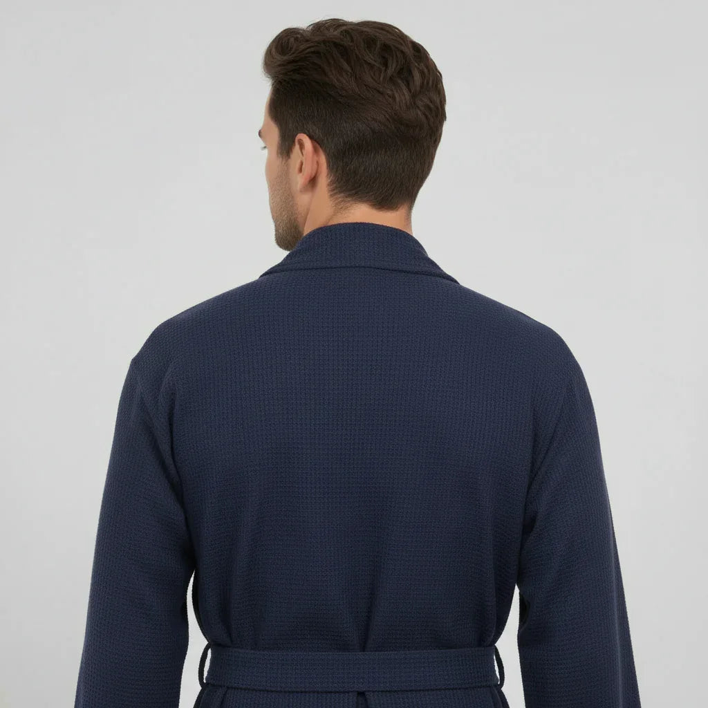 Navy blue Lotus Linen waffle spa bathrobe for men, lightweight and absorbent, shown from the back.