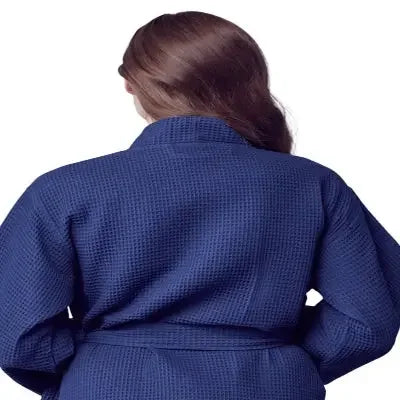 Navy blue knee-length waffle robe for women by Lotus Linen, showing the back view with textured fabric and relaxed fit.