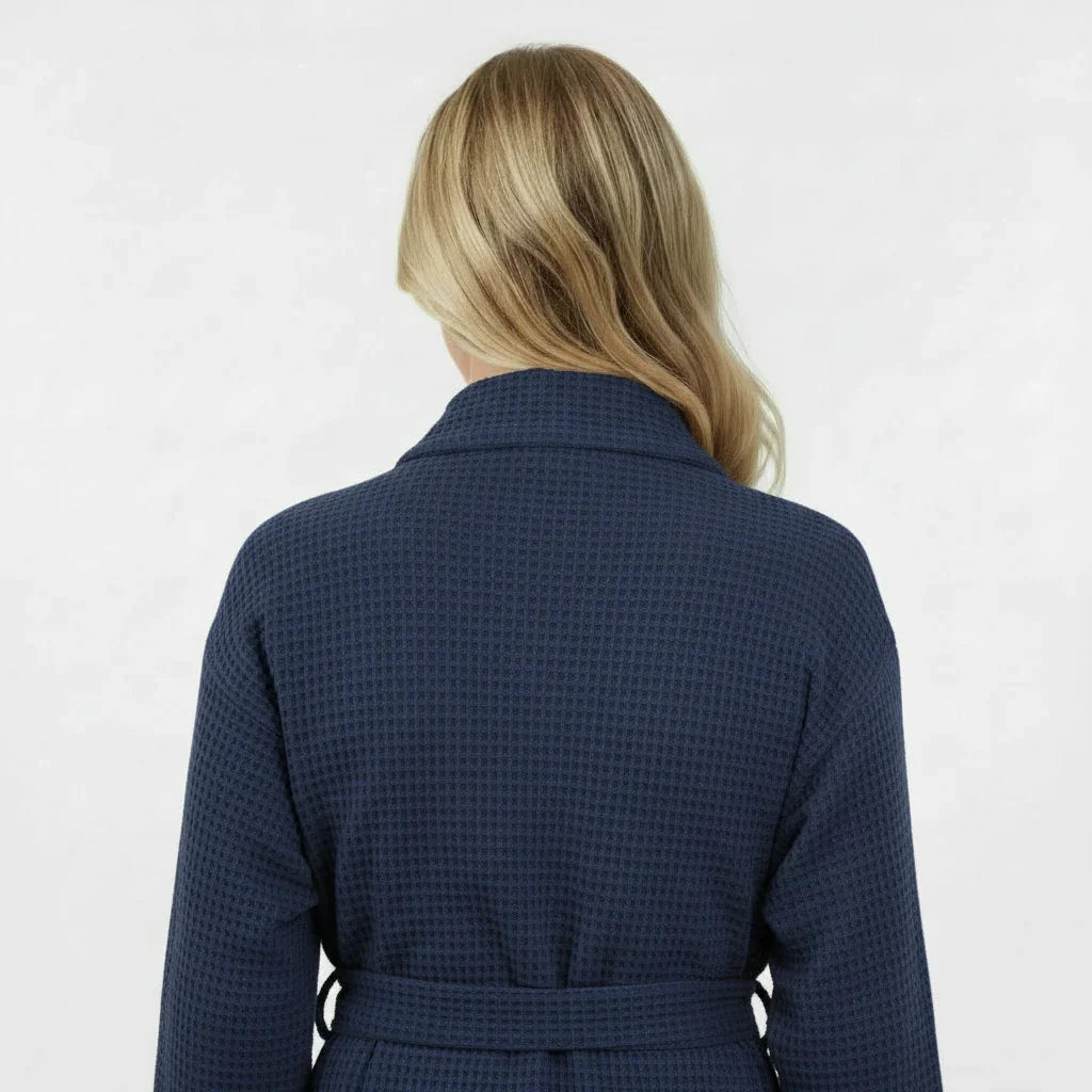 Back view of Lotus Linen navy knee-length waffle robe for women, showcasing the textured fabric and relaxed fit.