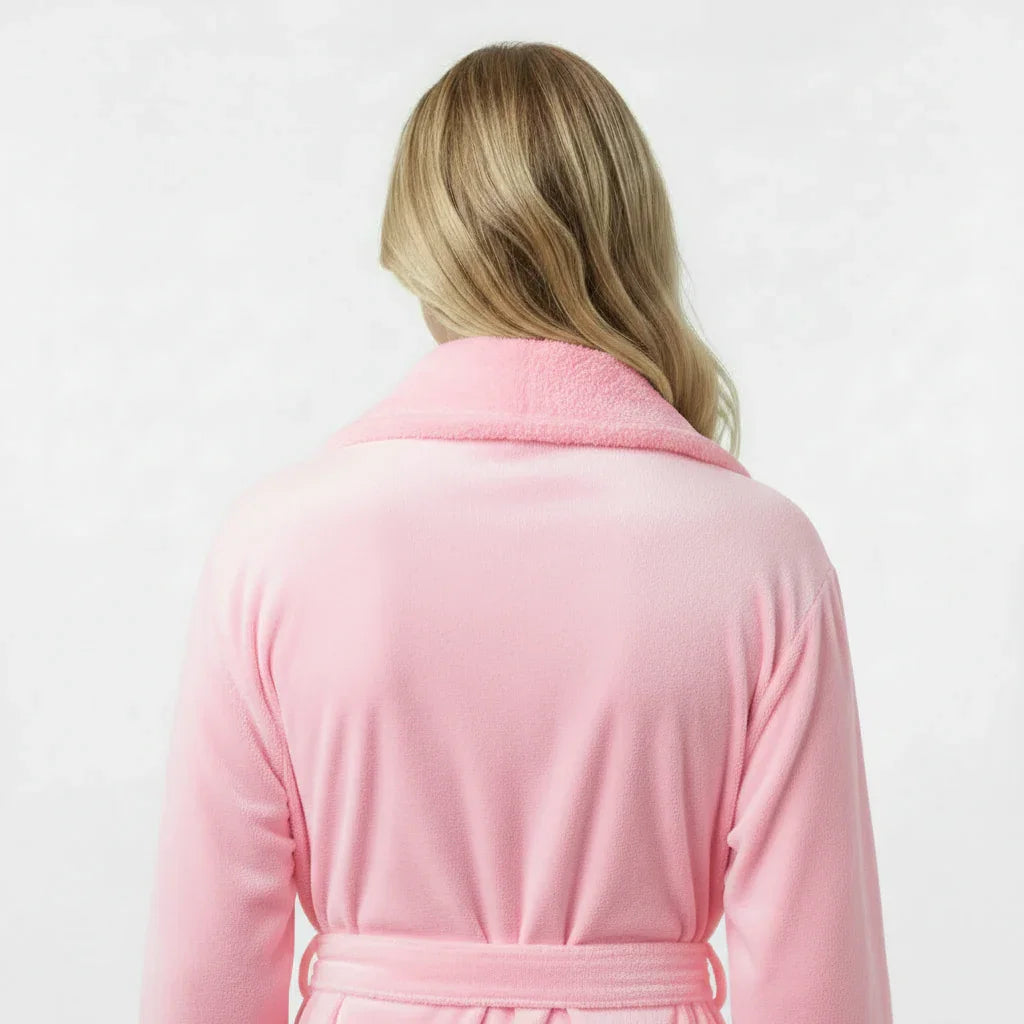 Back view of small pink women's plush bathrobe from Lotus Linen, showcasing soft, cozy fabric and relaxed fit.
