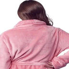 Back view of Lotus Linen women's ultra soft plush pink bathrobe with small collar and long sleeves, displayed on a hanger.