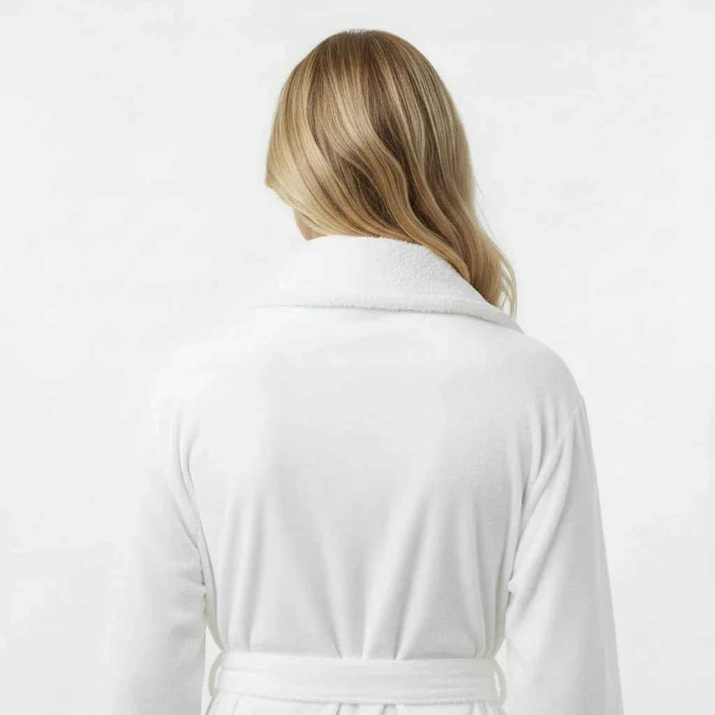 Back view of Lotus Linen women's ultra-soft plush bathrobe in white, showing the cozy, plush fabric and relaxed fit.