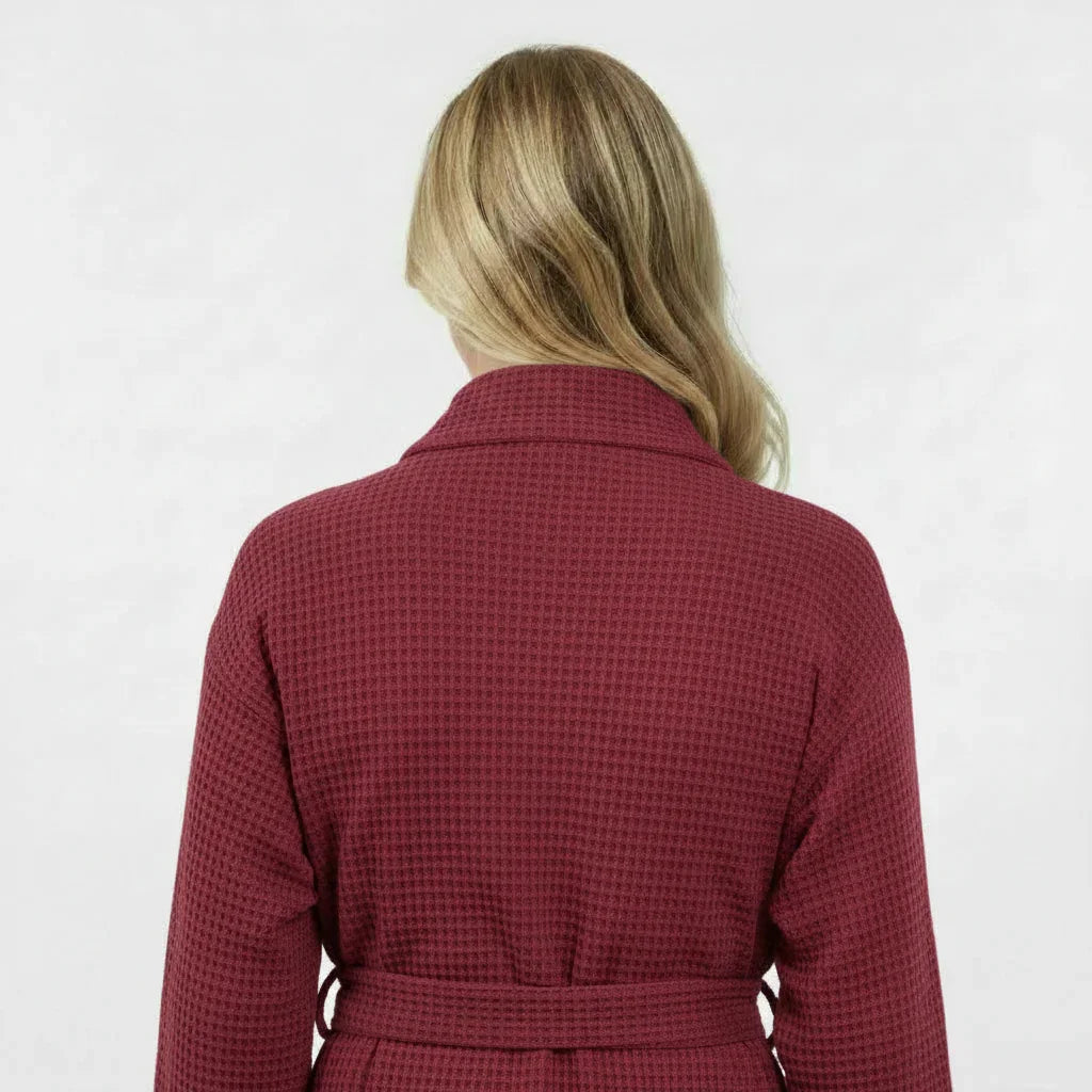 Back view of Lotus Linen Women's lightweight waffle robe in wine red, showcasing quick-dry spa comfort and cozy fit.