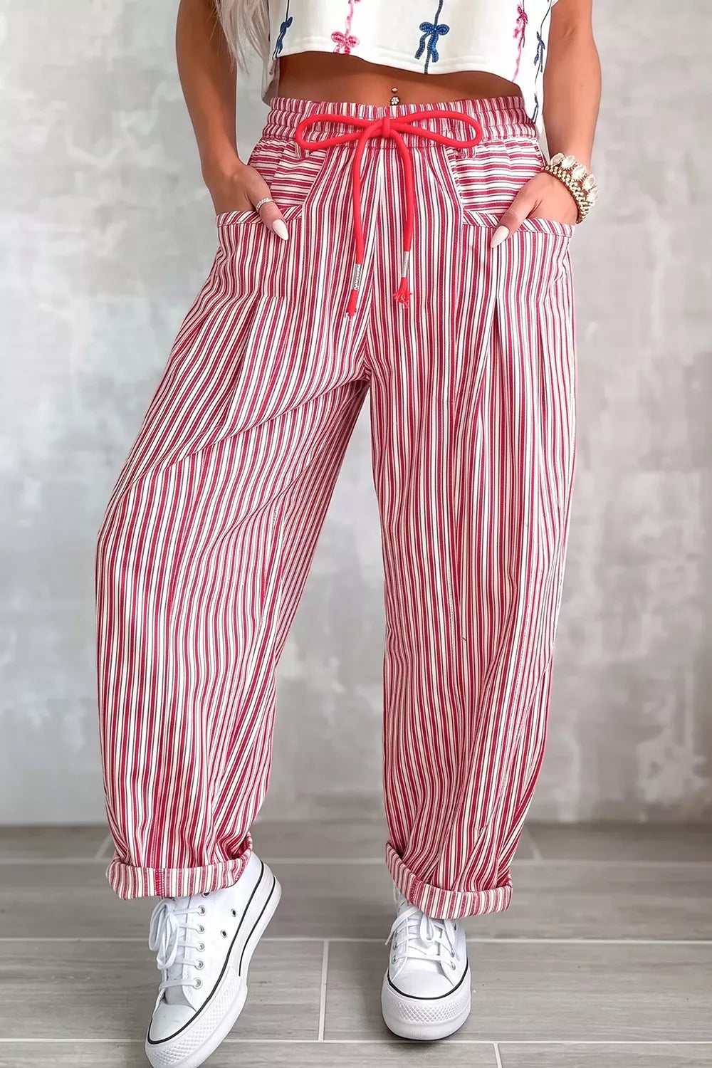 Loose stripe drawstring casual pants by Trendsi featuring relaxed fit and adjustable waist in soft fabric.