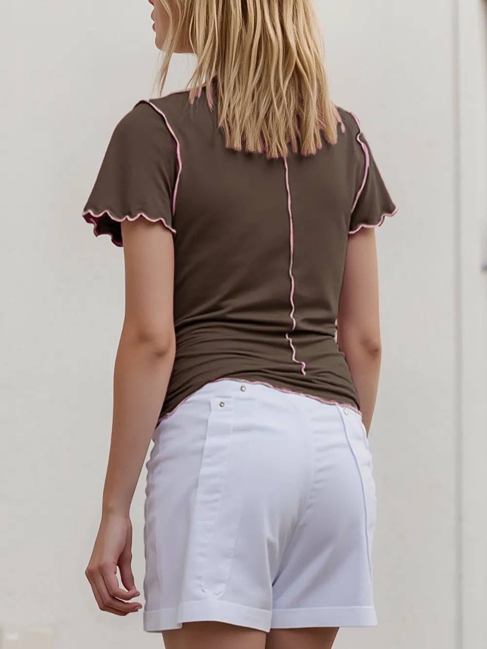 Women's contrast trim mock neck short sleeve knit tee by Plush Fashion Hub, featuring a fitted stretch fabric and stylish design.