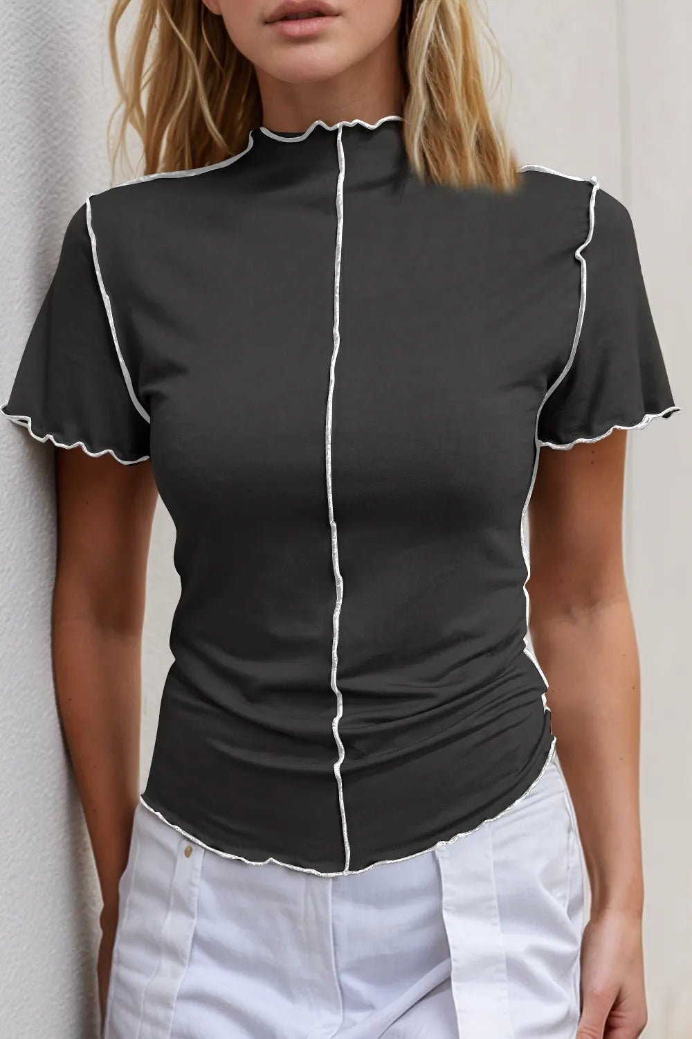 Women's stretch knit short sleeve tee with contrast trim and mock neck from Plush Fashion Hub, showing a fitted, stylish top.