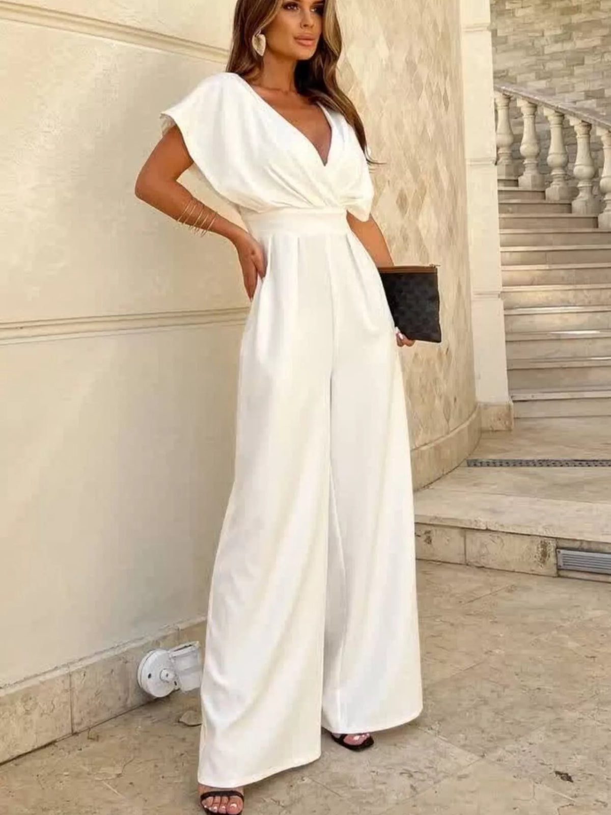 Plush Fashion Hub white surplice wide leg jumpsuit with long sleeves and tie waist, stylish and comfortable for casual wear