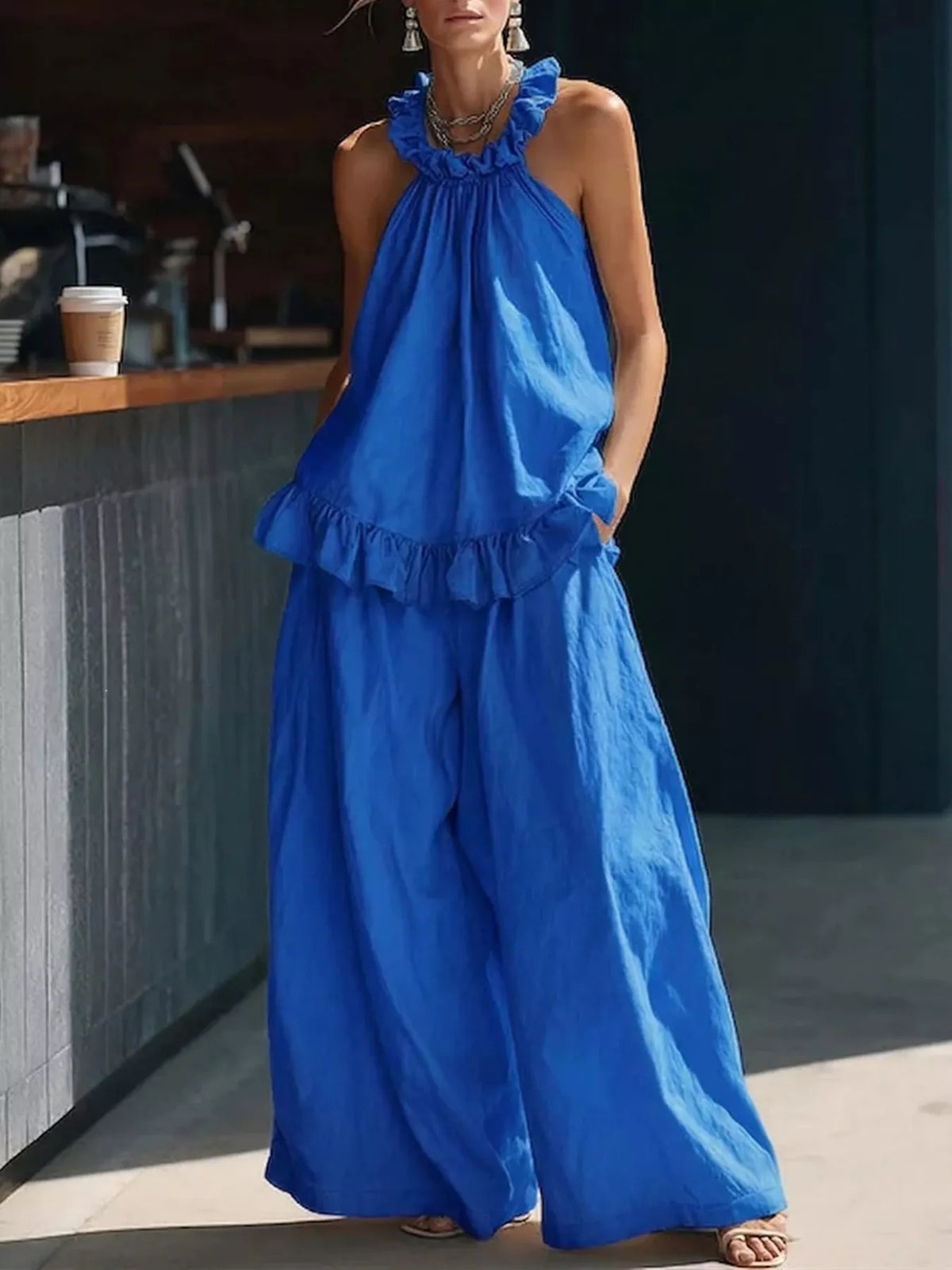 Plus size ruffled halter neck top and wide-leg pants matching set from Plush Fashion Hub, styled for a trendy look.
