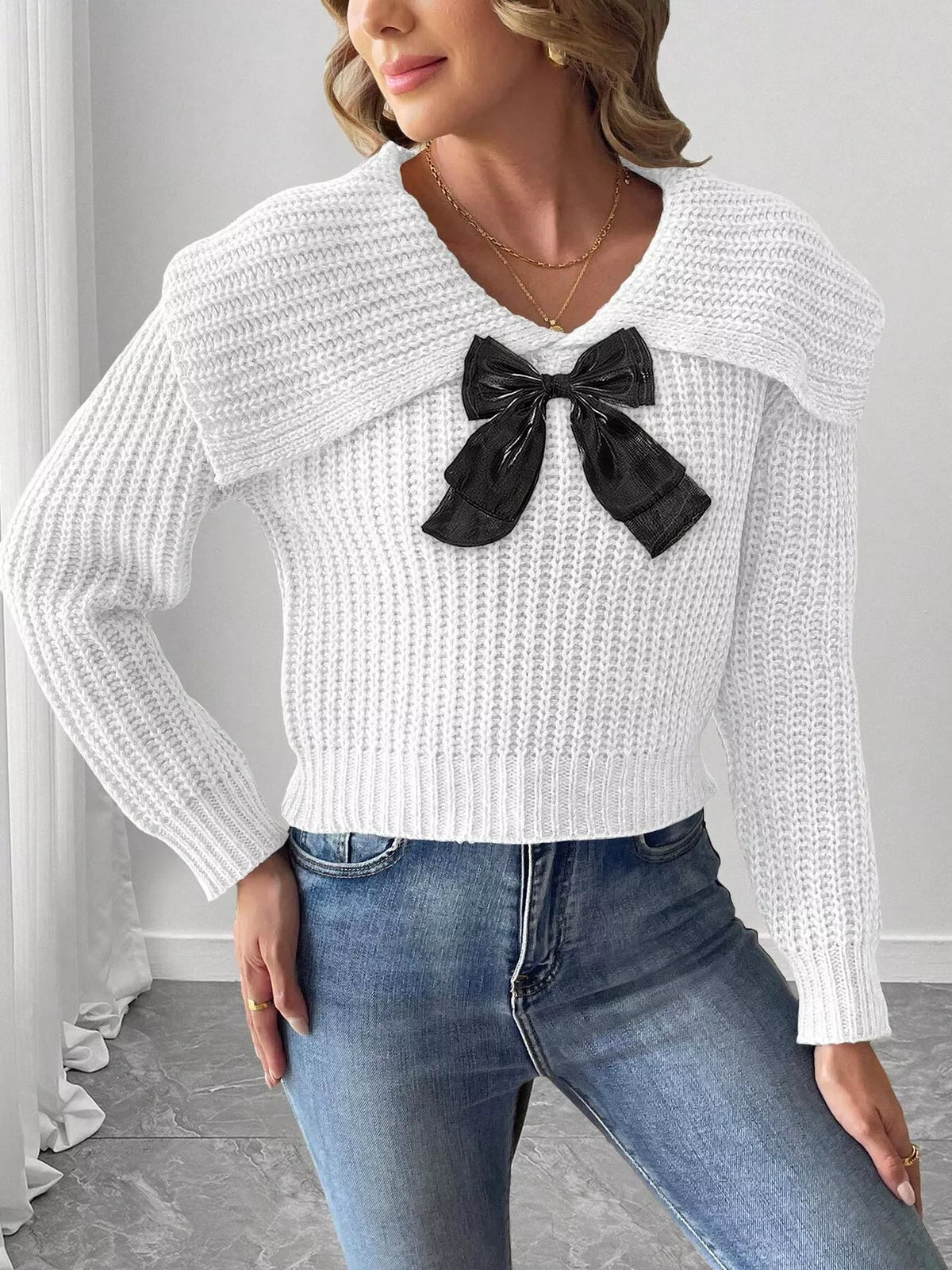 Contrast bow long sleeve sweater paired with a stylish skirt, featuring a trendy design from Trendsi.