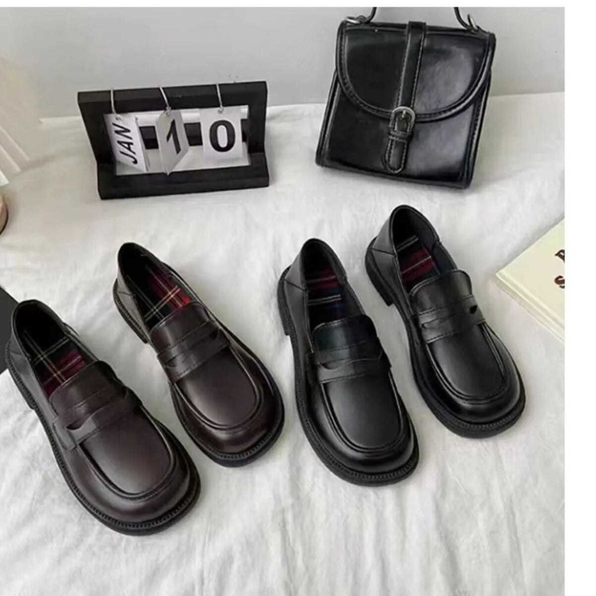 Women's leather loafers with round toes, stylish Trendsi shoes featuring sleek design and comfortable fit.