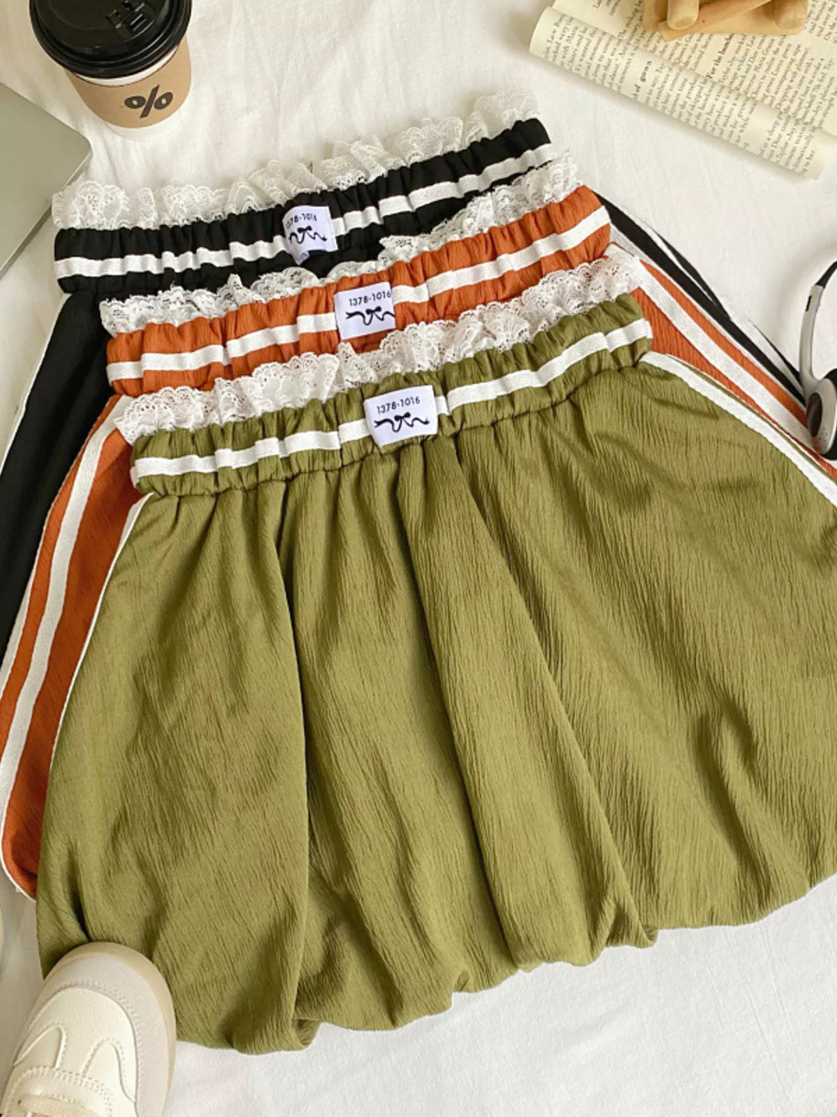Plush Fashion Hub lace trim elastic waist mini skirt showing a stylish black skirt with delicate lace details and a comfortable fit.