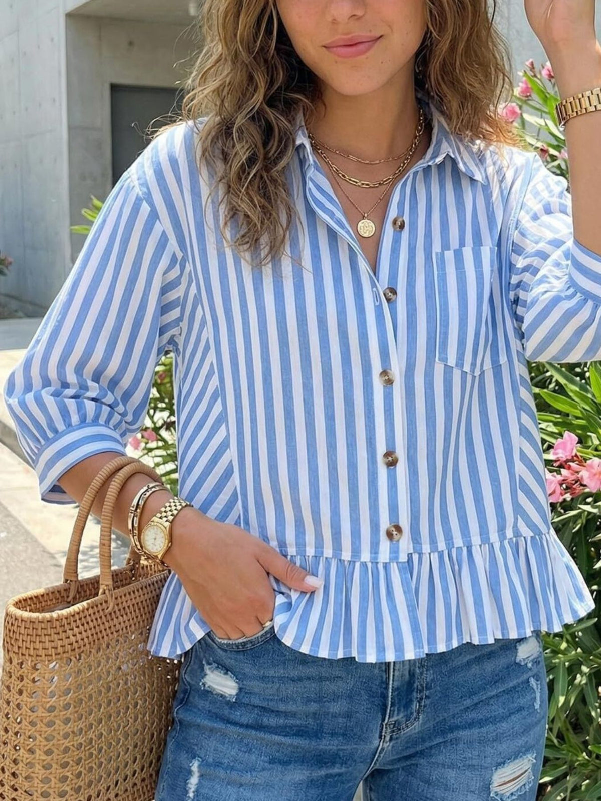 Women’s striped button-down blouse by Plush Fashion Hub, lightweight viscose fabric with ruffled hem and relaxed fit.