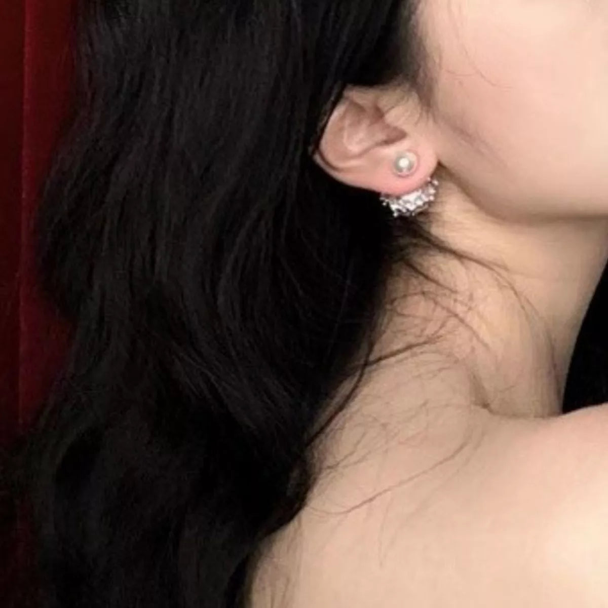 Elegant pearl stud earring from Plush Fashion Hub featuring a classic round pearl design on a shiny metal post.