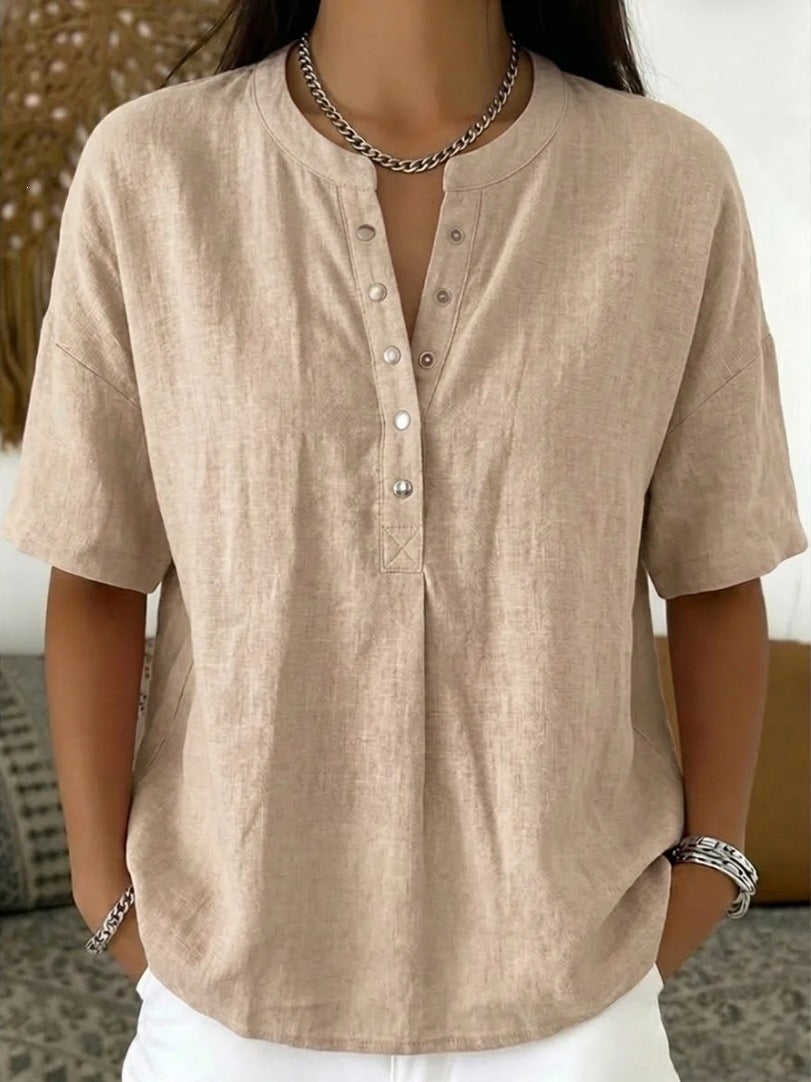 Women's solid color loose-fit short-sleeve pullover top by FitiqueFit, casualwear, displayed on a hanger with a relaxed fit.