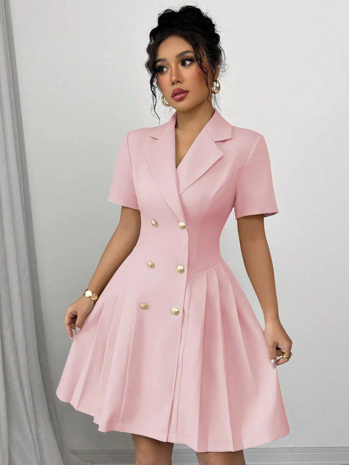 Plush Fashion Hub double-breasted pleated blazer dress featuring structured shoulders and tailored fit on a model.