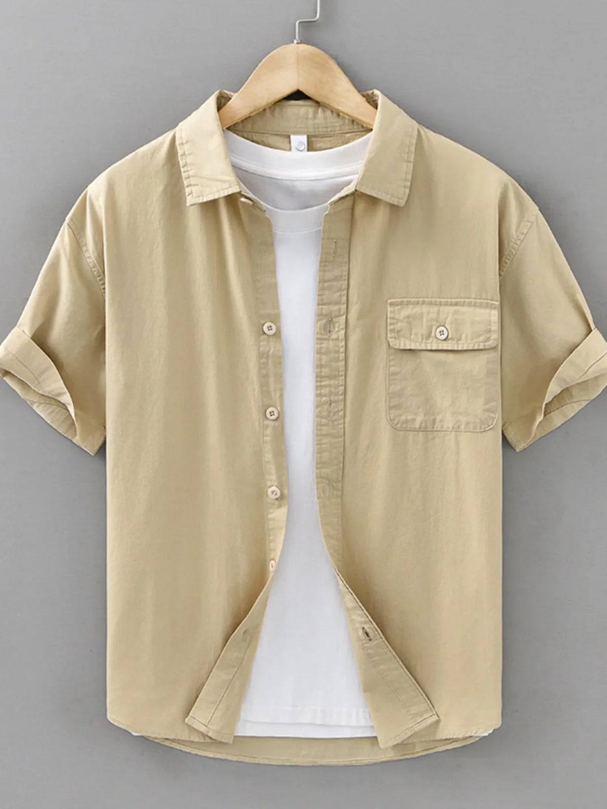 Plus size men's short sleeve button-up shirt by Plush Fashion Hub, featuring a classic collar and stylish design.