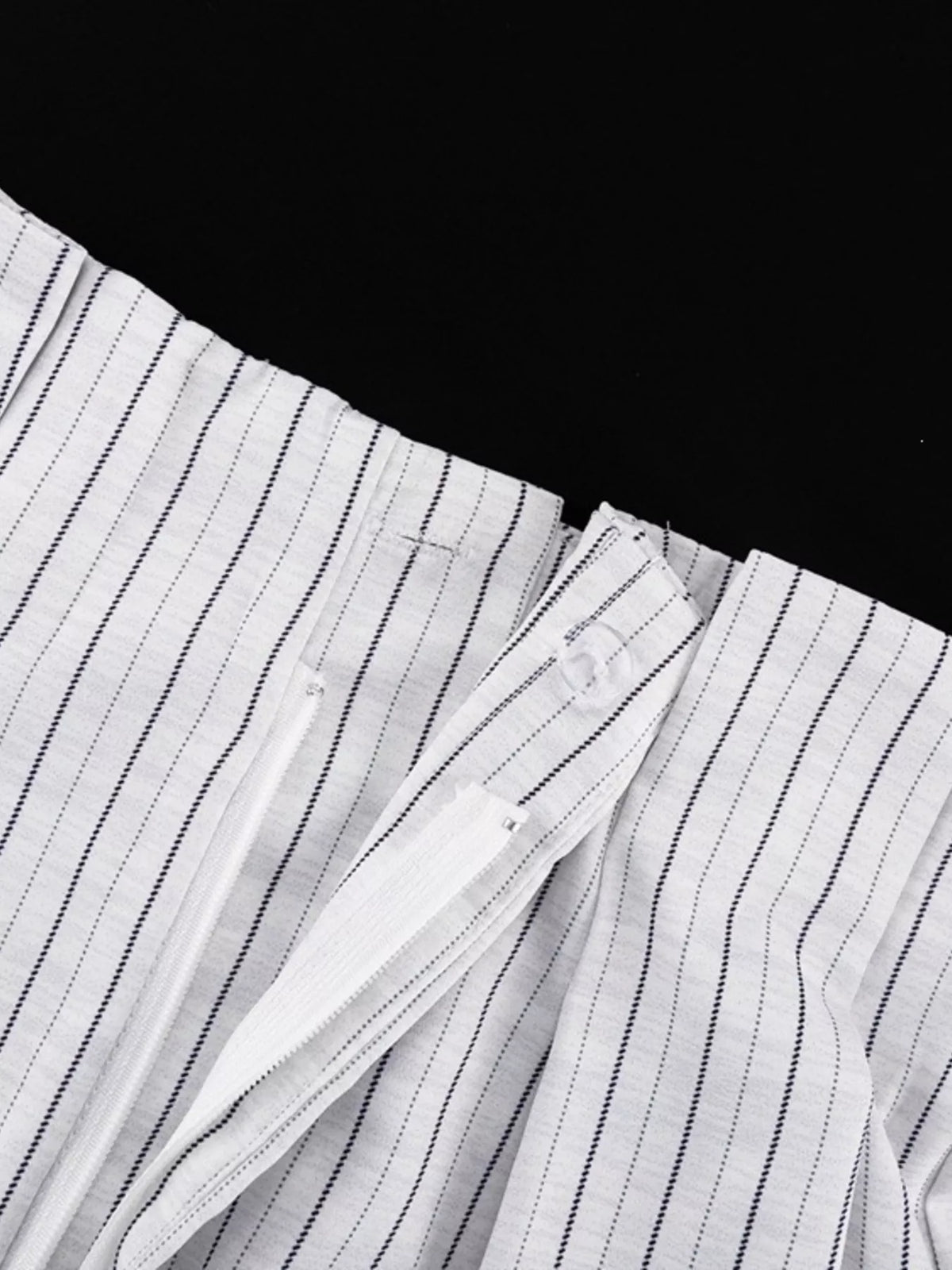 Trendsi pinstripe cropped blazer and pleated shorts set, featuring a tailored blazer and matching high-waisted shorts.