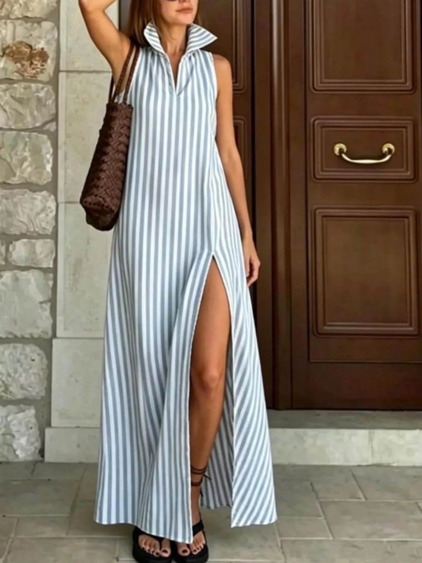 Plus size striped maxi dress with high slit by Trendsi, featuring full-length design and stylish color contrast.