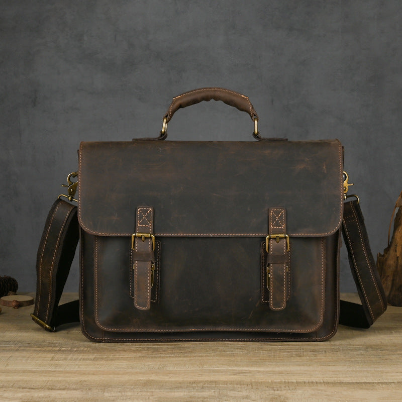 Pi-Mart leather one-shoulder crossbody laptop bag with top layer leather, featuring a sleek design and adjustable strap.