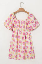 Floral square neck puff sleeve cotton midi dress with pleated flared skirt, trendy design, worn by a model showing the full dress.