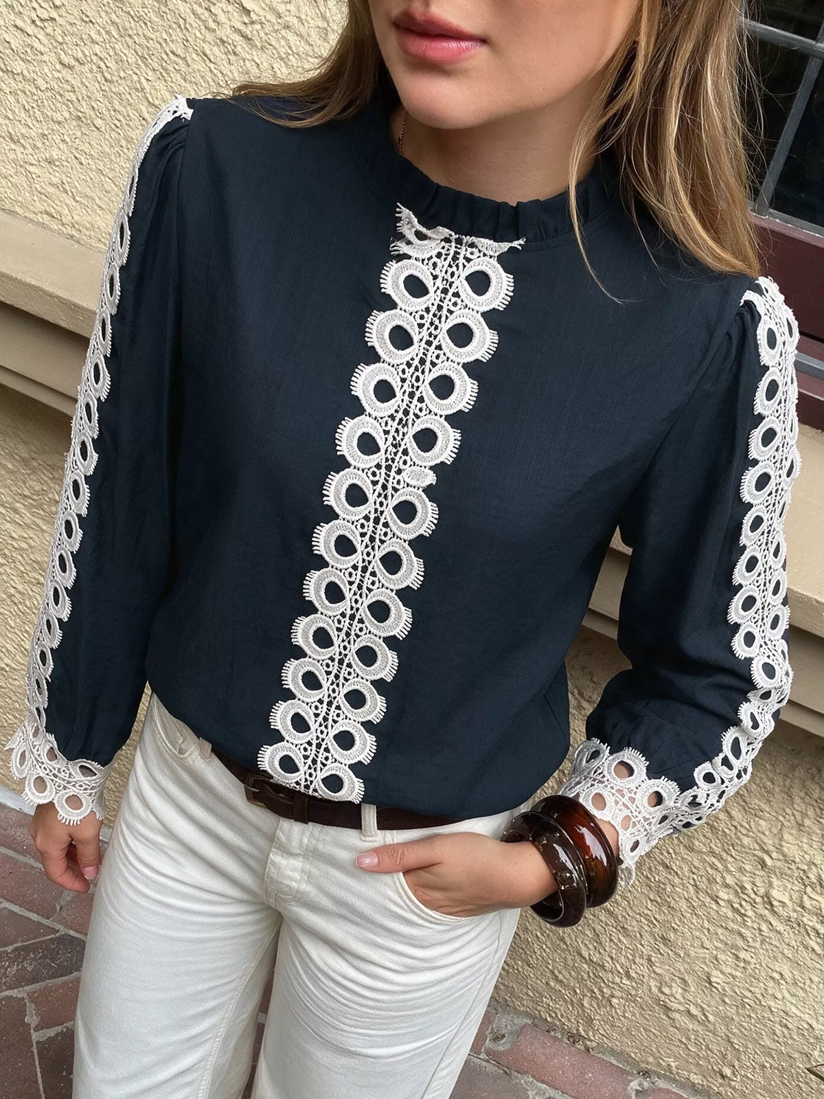 Lace trim long sleeves blouse by Trendsi featuring delicate lace details and a stylish, feminine design.