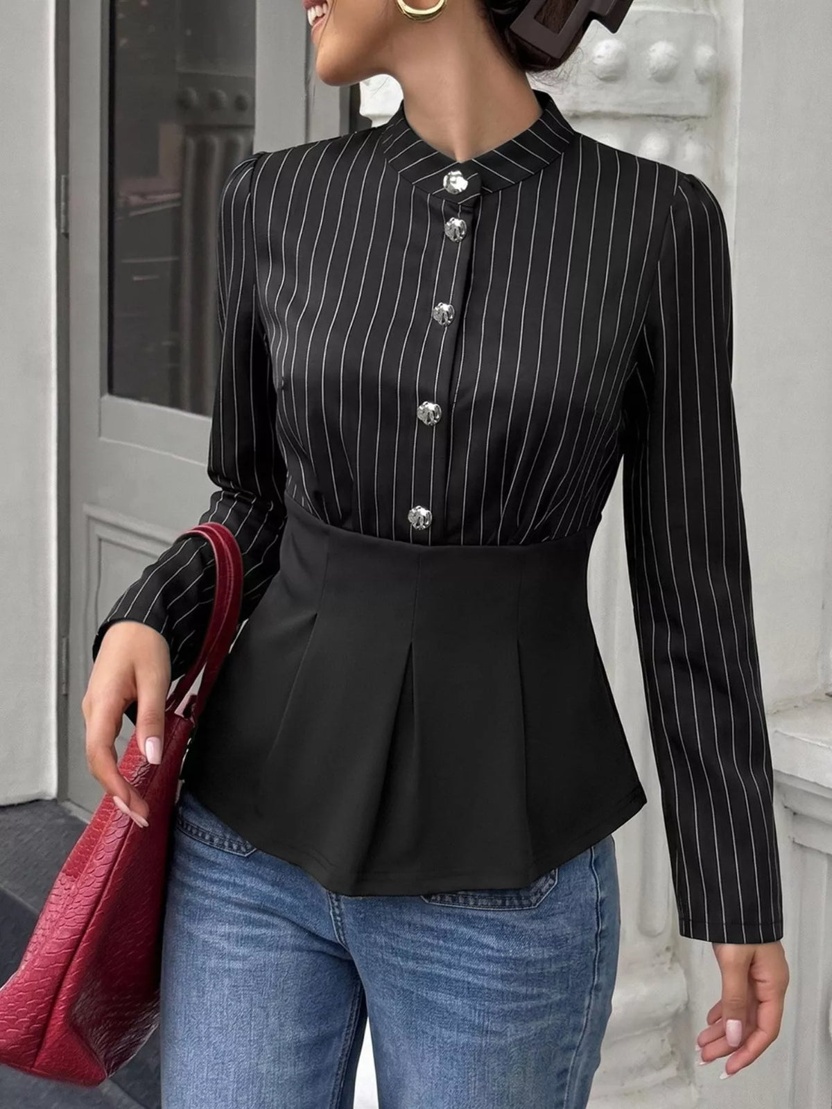 Striped long sleeve peplum blouse for women by Trendsi, featuring a fitted waist and classic pattern, shown on a mannequin.