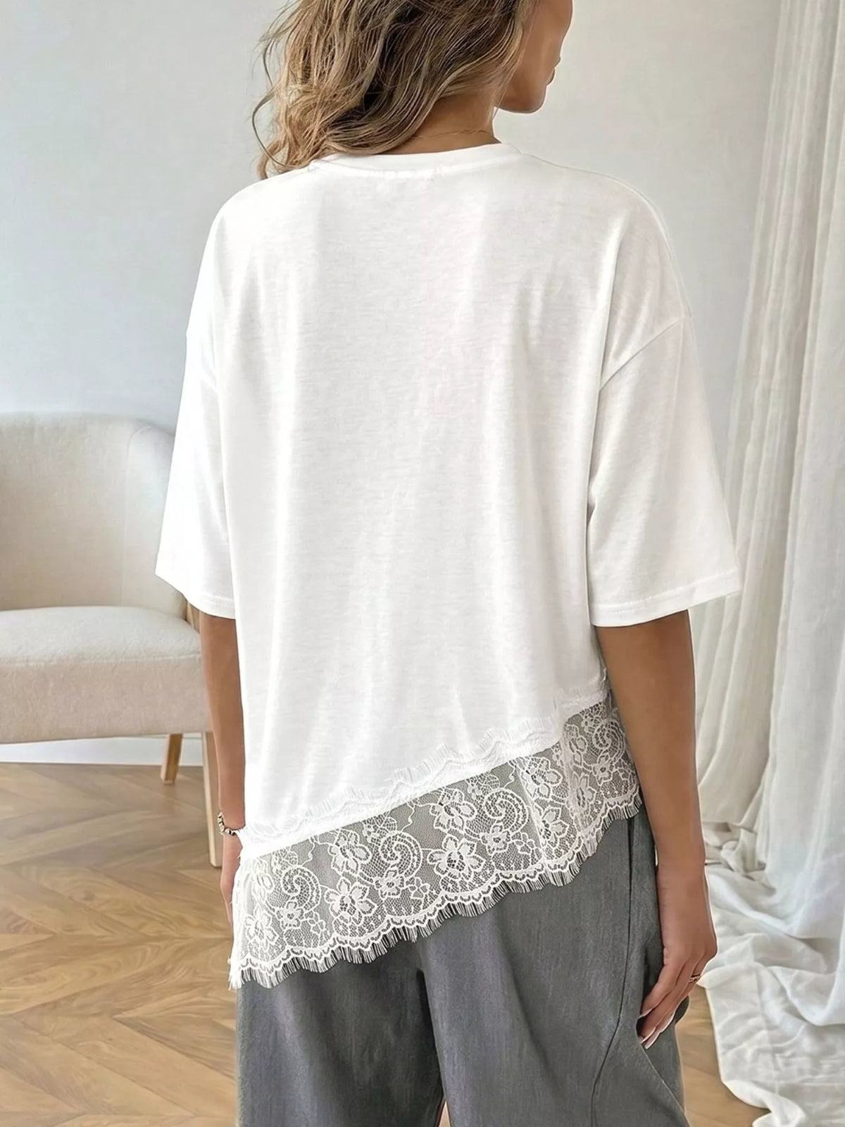Plush Fashion Hub lace detail half sleeve T-shirt featuring elegant lace accents on a casual cotton shirt.