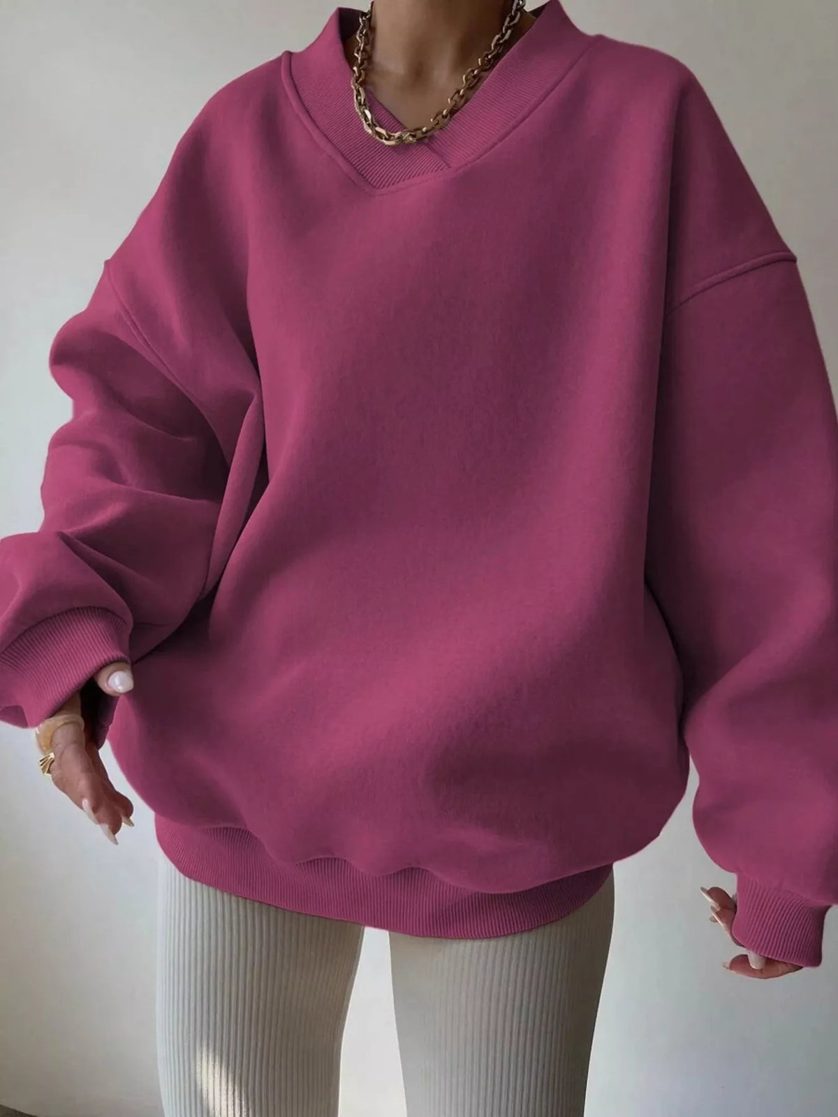 Oversized dropped shoulder long sleeve sweatshirt by Trendsi, featuring a relaxed fit and casual style, shown in the image.