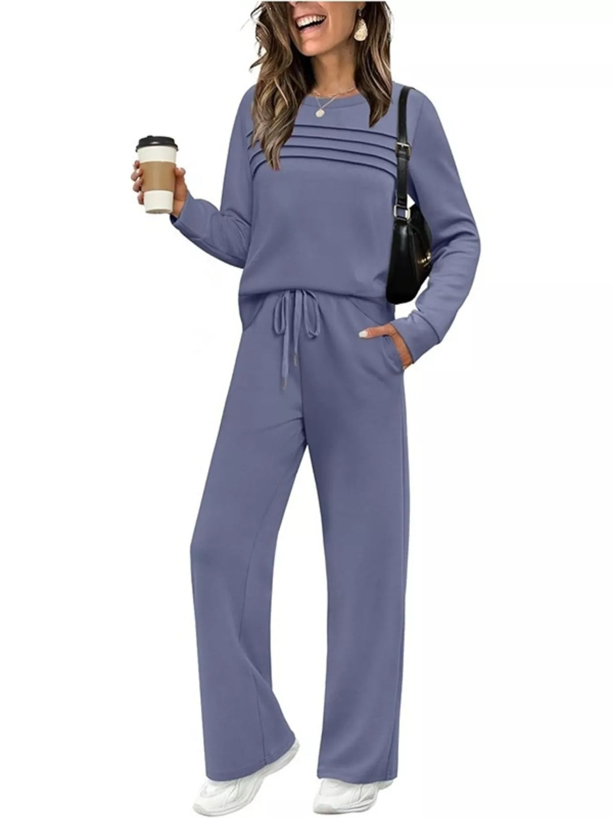 Plus size casual long sleeve crewneck top and drawstring pants matching set from Trendsi, featuring comfortable fabric and relaxed fit.